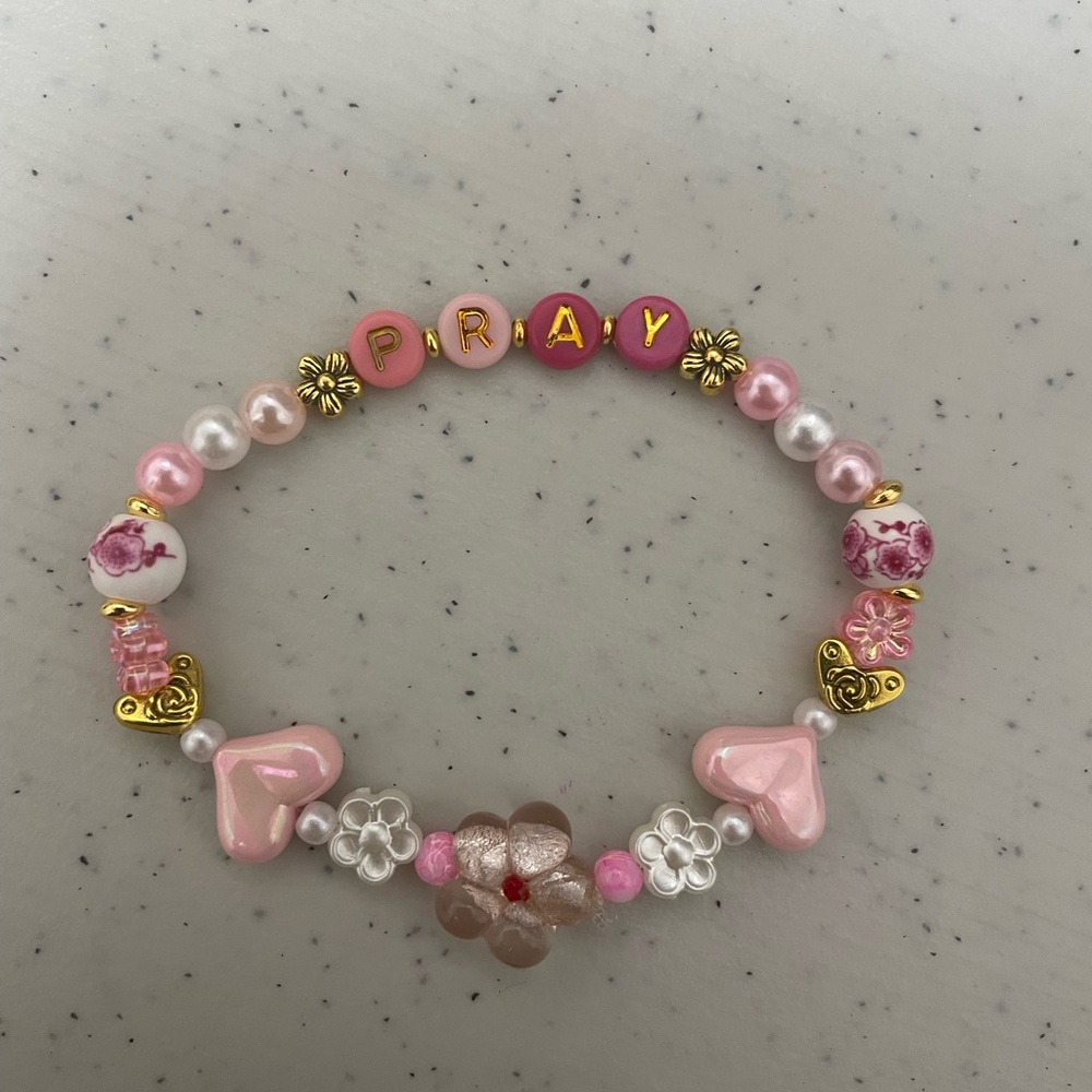 Pray bracelets in assorted dc designs for gifting